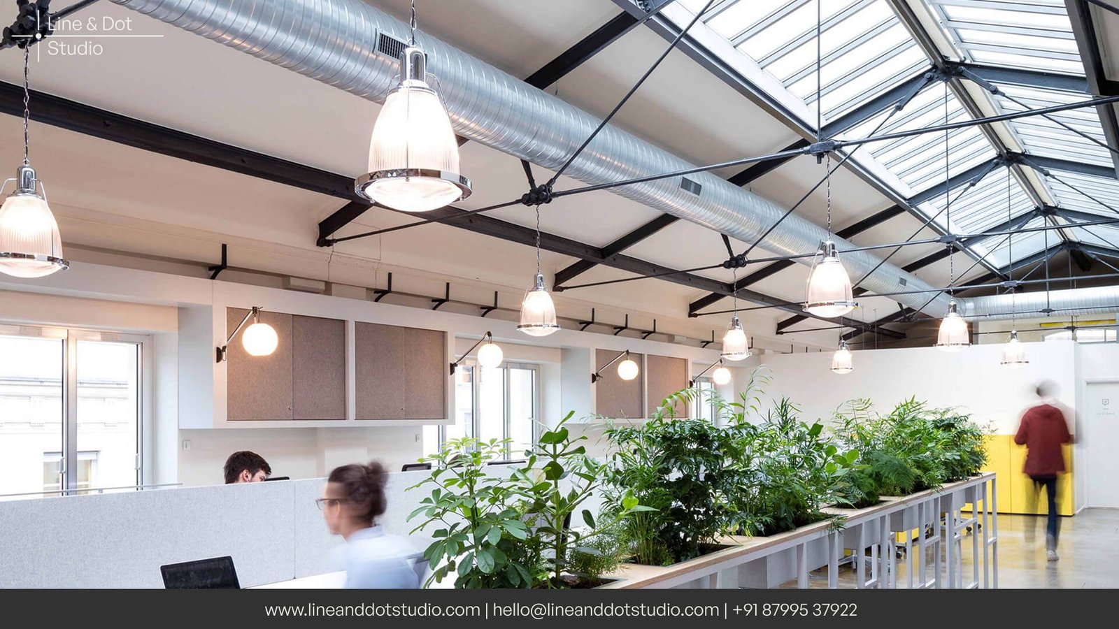 Biophilic principles inspired office space with large skylights and indoor plantation for a healthy workspace