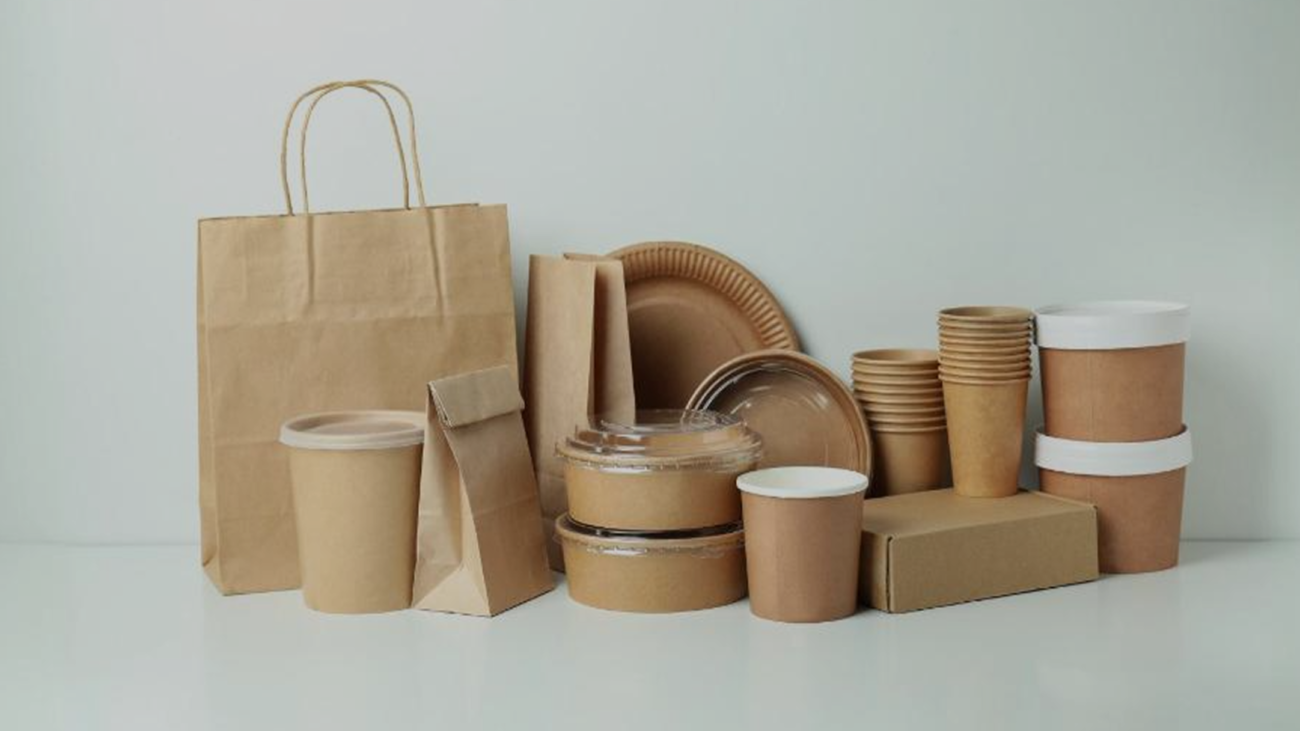 different types of packaging placed on white table with white background