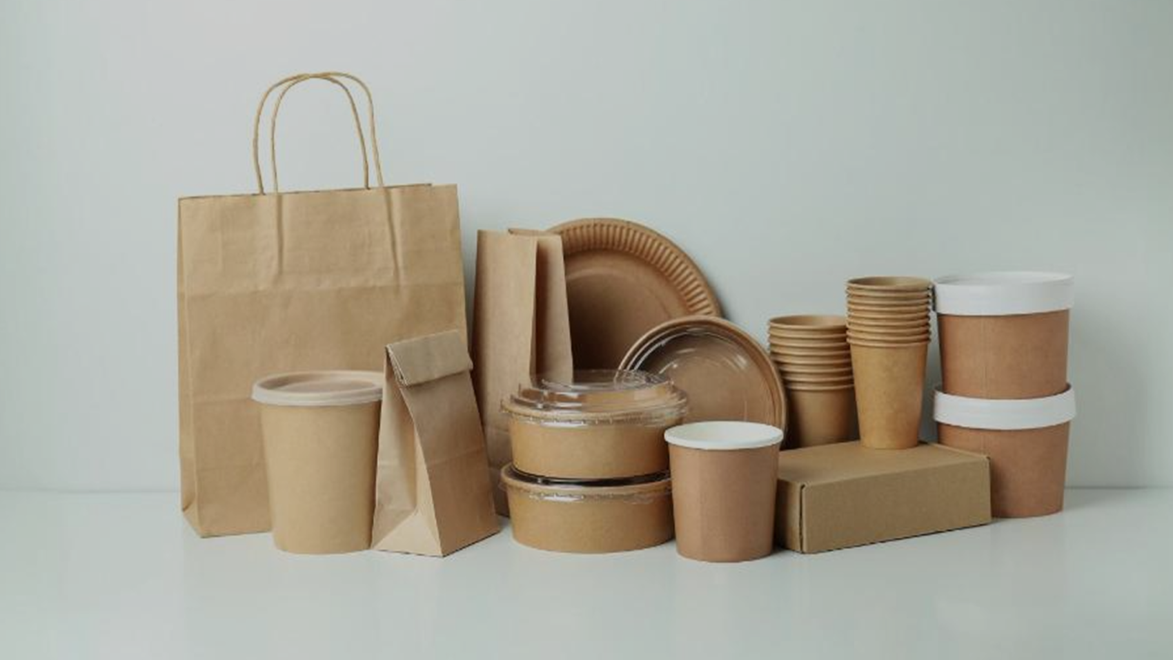 different types of packaging placed on white table with white background