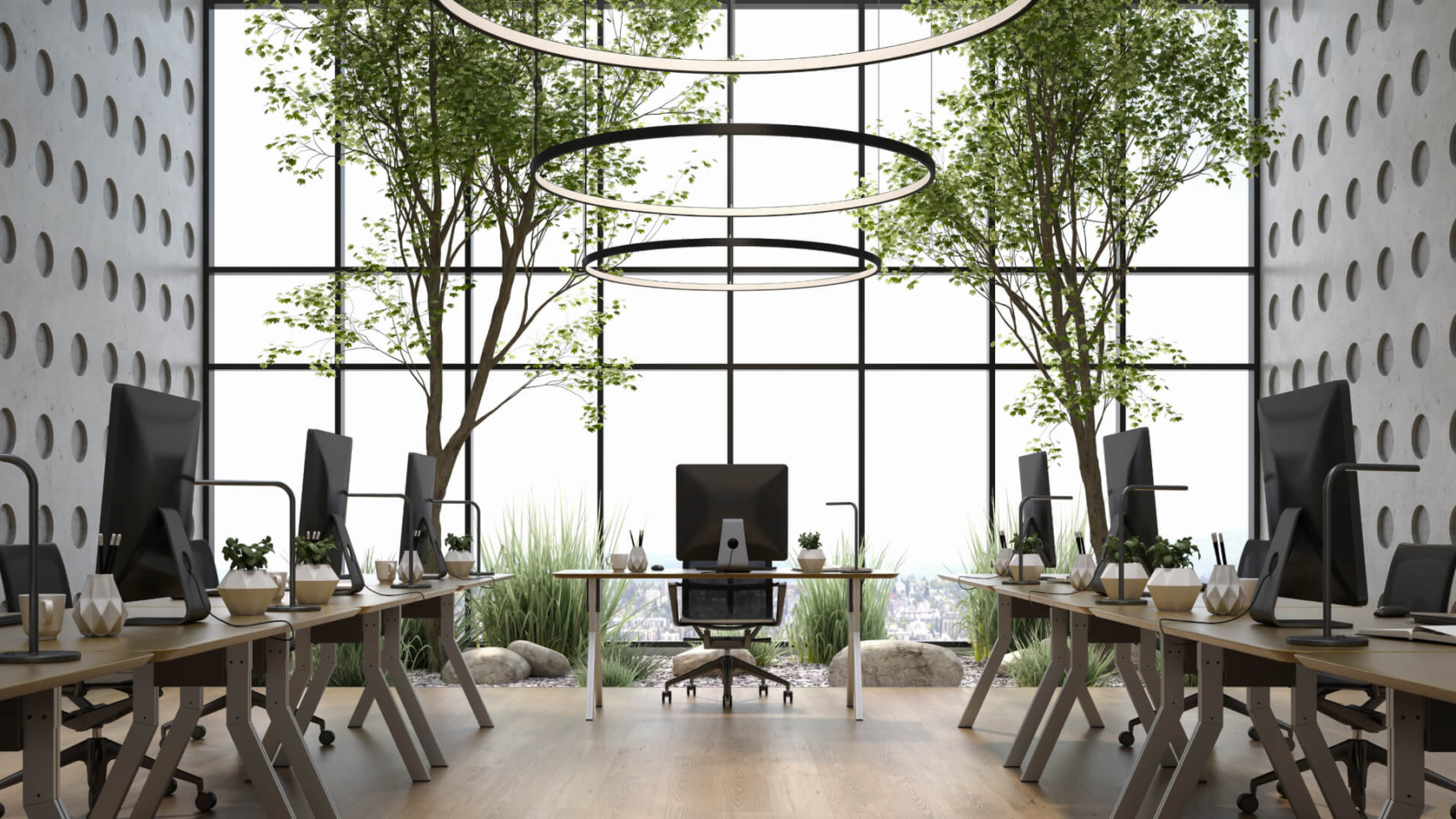 A concept of a biophilic office design with desks on either sides and a tall glass facade for sunlight and lots of greenery on the inside
