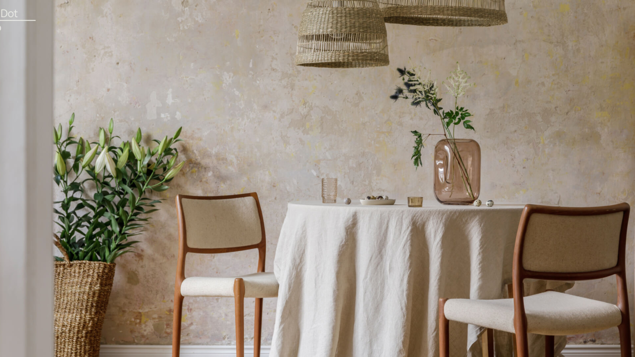 Eco friendly sustainable interior design products including bamboo dining set, jute table cloth, recycled-glass vase.