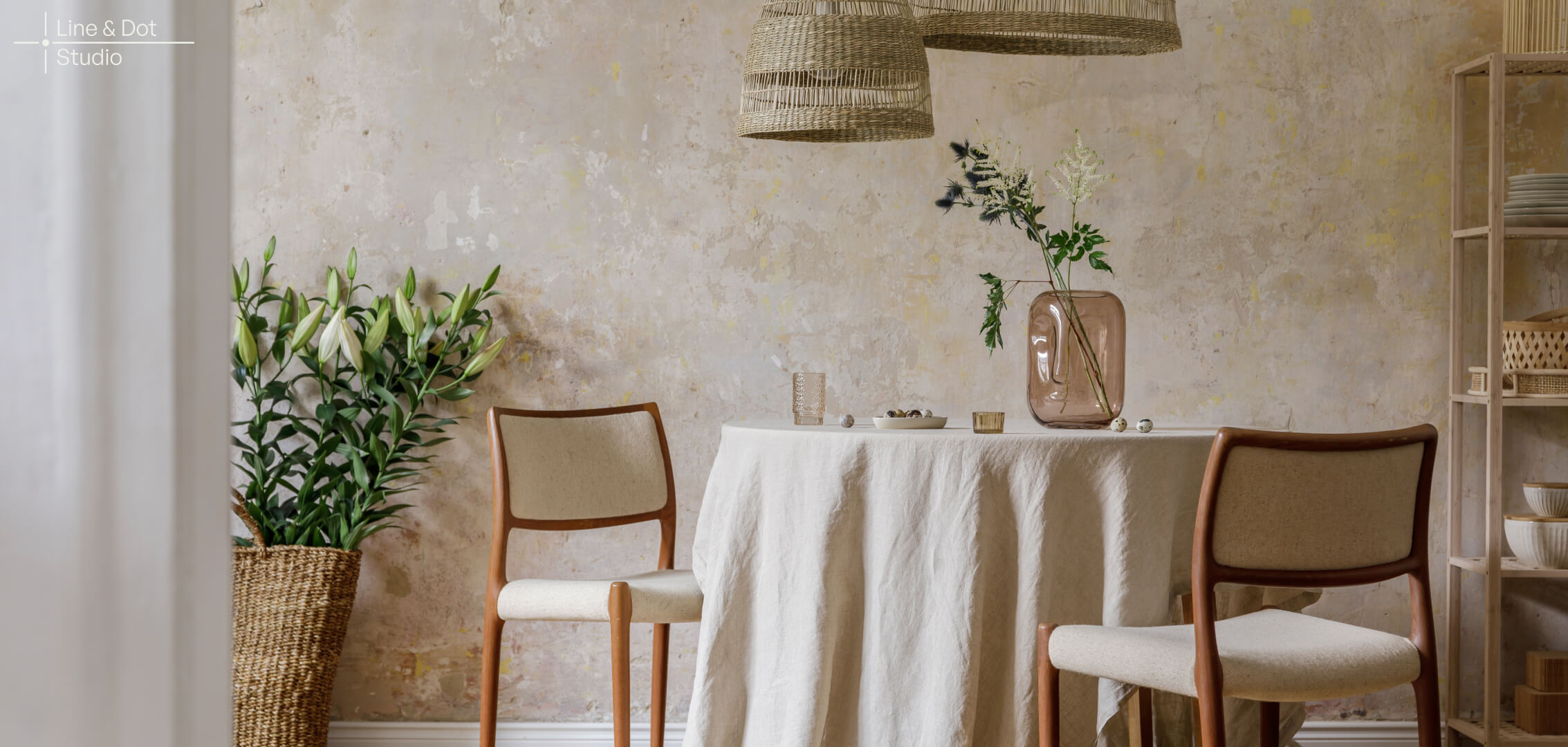 Eco friendly sustainable interior design products including bamboo dining set, jute table cloth, recycled-glass vase.